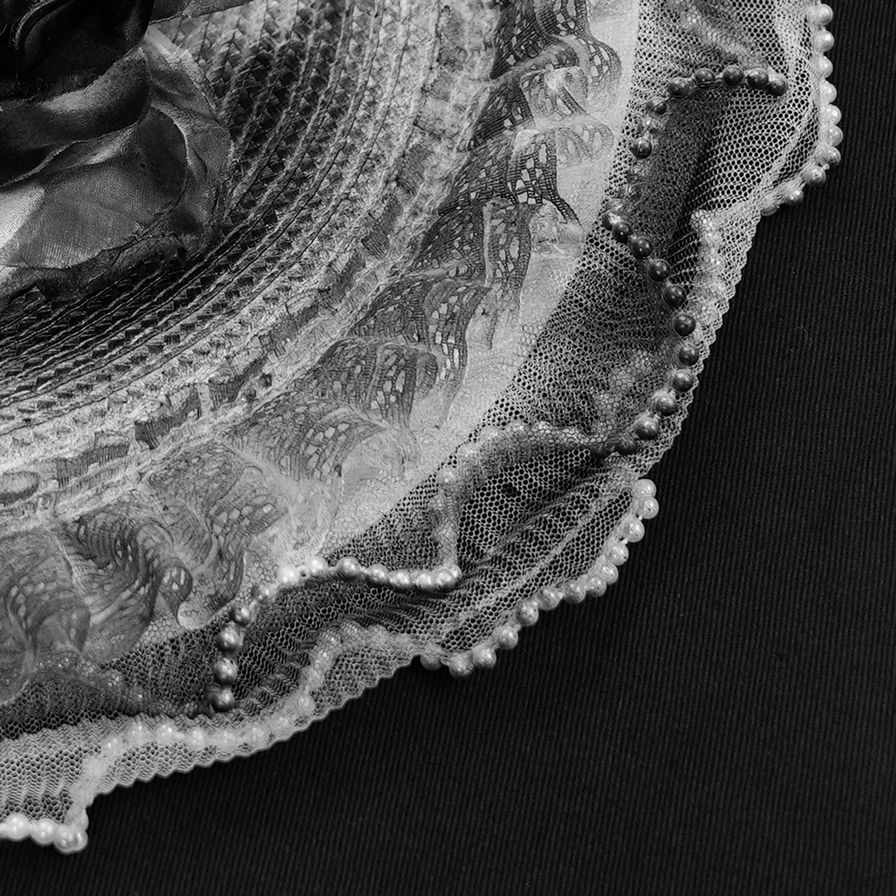 Elegant Black and White Floral Fascinator Hat with Feathers